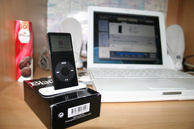 iPod nano (black), white MacBook and JBL loudspeakers